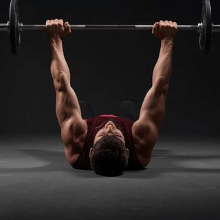 Barbell Curls Lying Against An Incline