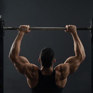 Lying Close-Grip Bar Curl On High Pulley