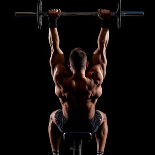 Palms-Up Barbell Wrist Curl Over A Bench